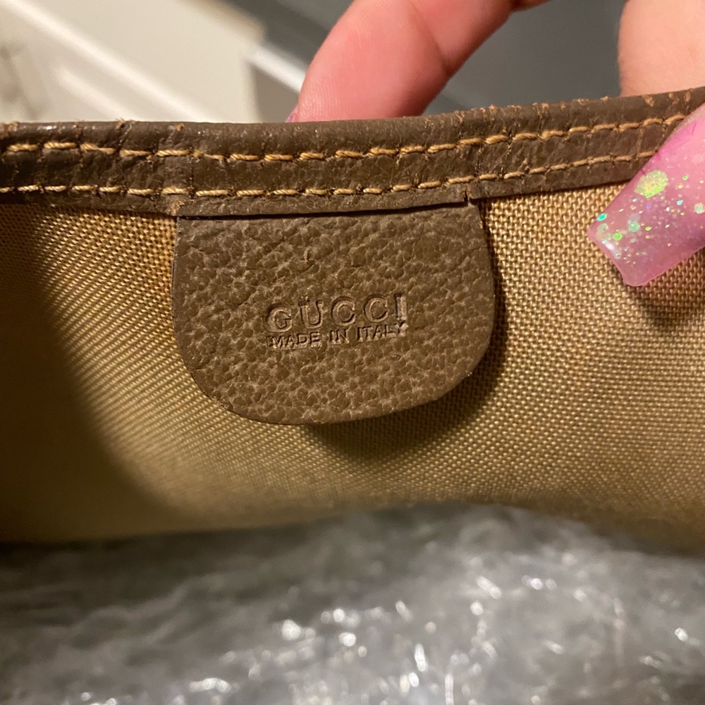 Vintage Gucci monogram with leather trim. Dust bag included.